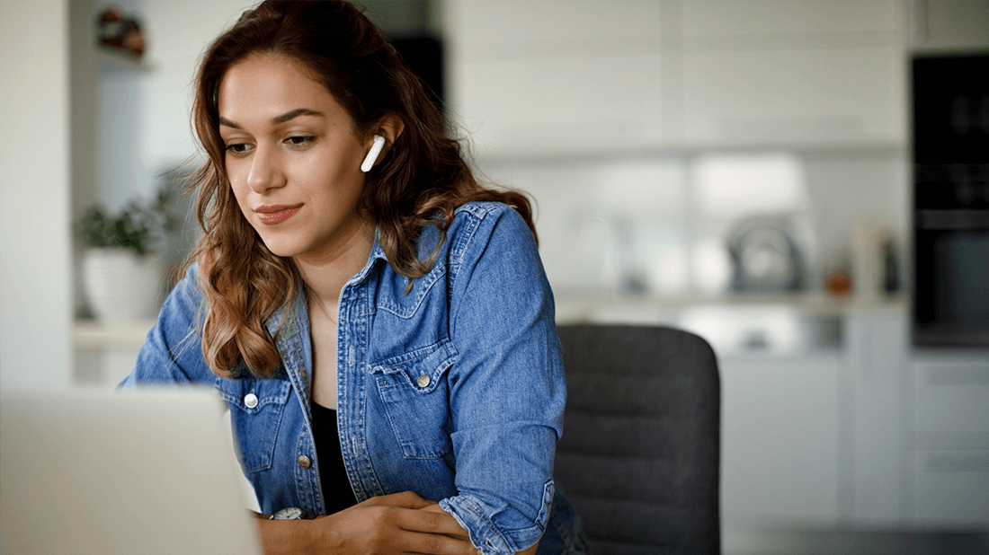 Woman on laptop with air pods