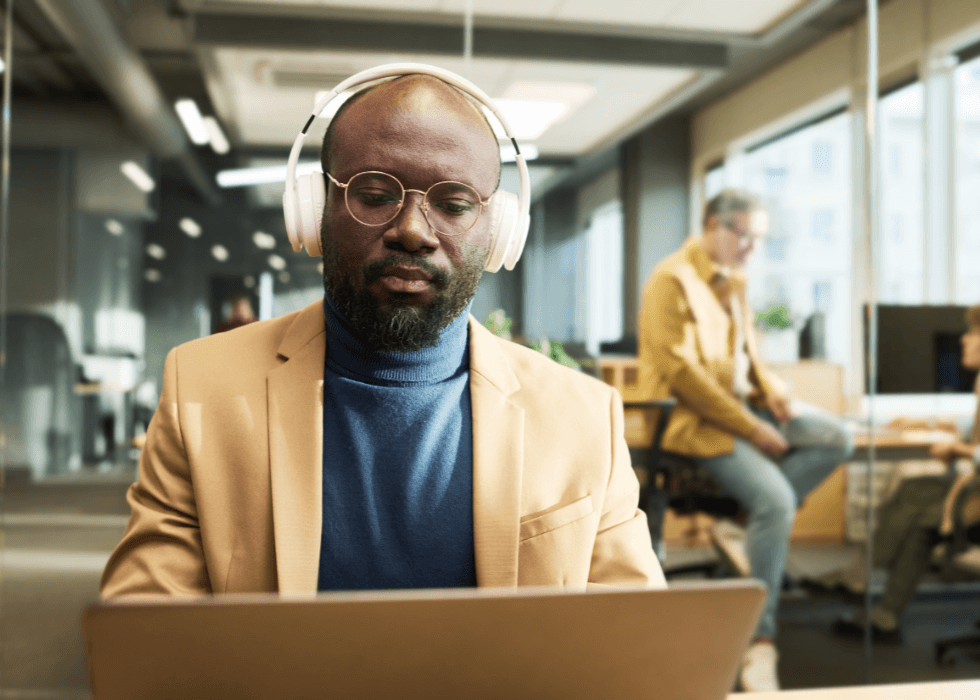 Man wearing headphones in office