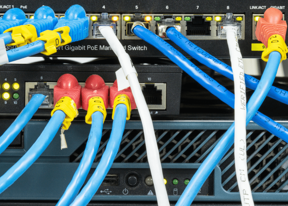 Network hub with LAN cable connected to patch cables connected to internet data center